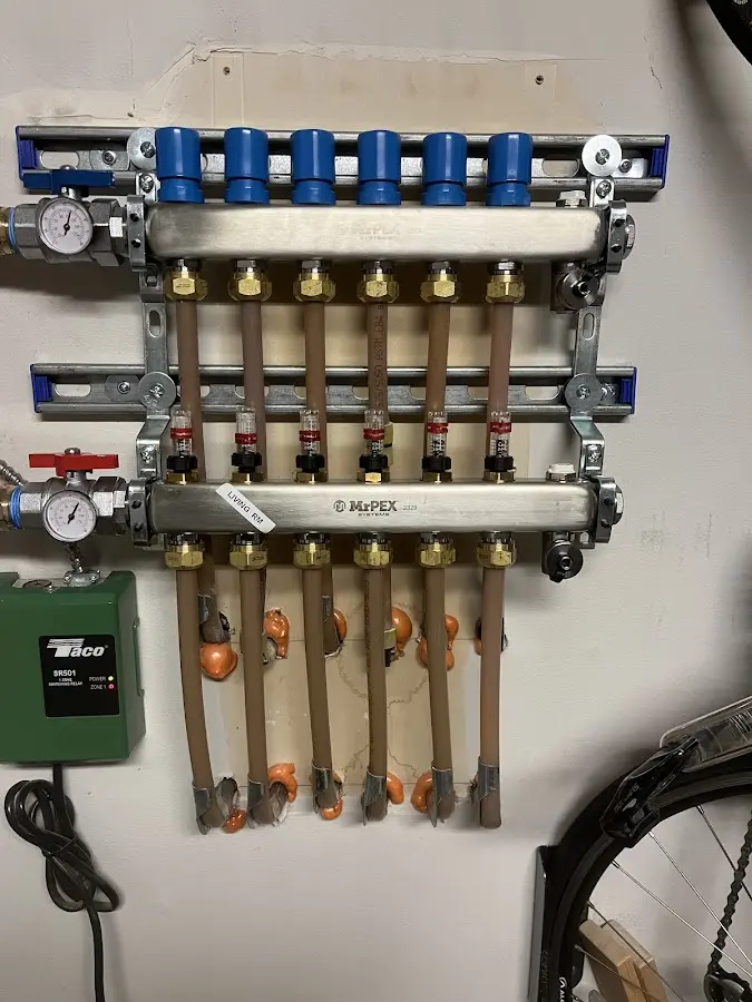 Plumber performing Water Heater Repair at a residential property in Belmar